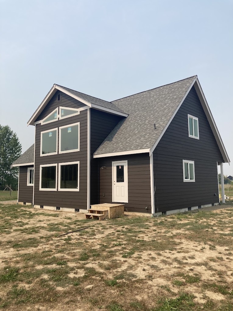 Large home exterior paint job. Located near the Sequim airport